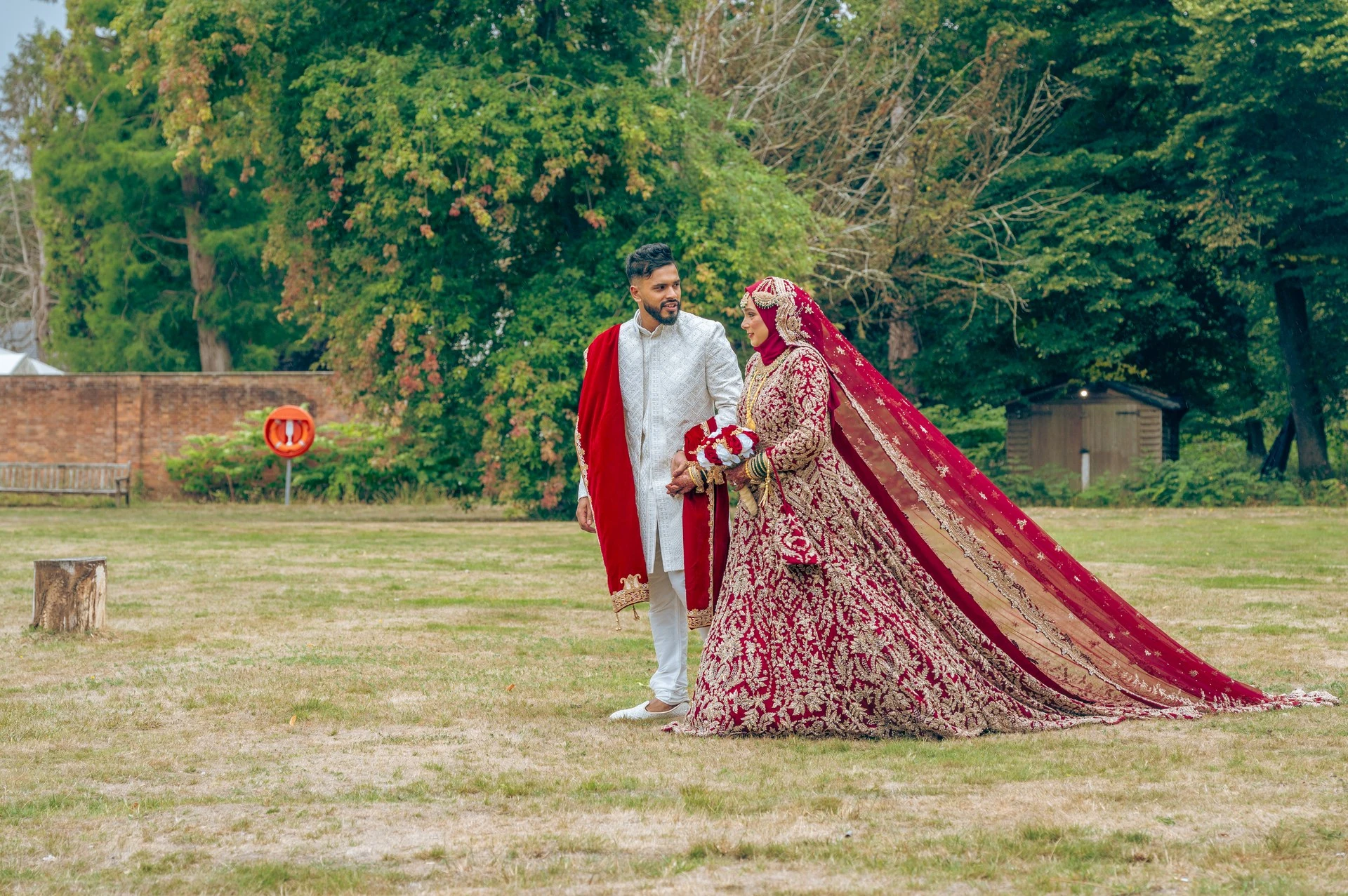 Bride and groom in traditional wedding attire, luxury wedding photography by Eyecon Moments