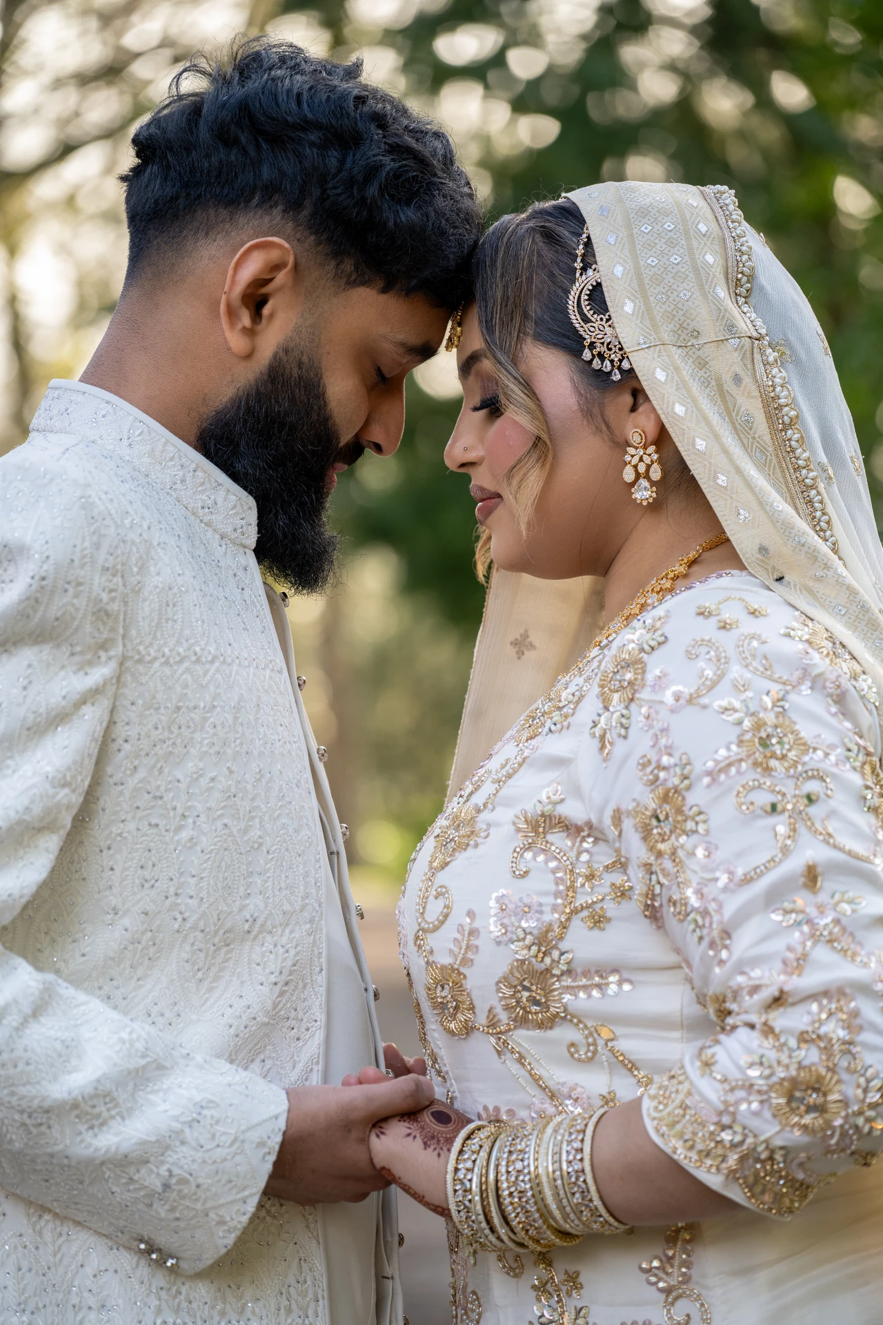 Bride and groom in white Nikah attire, luxury wedding photography by Eyecon Moments